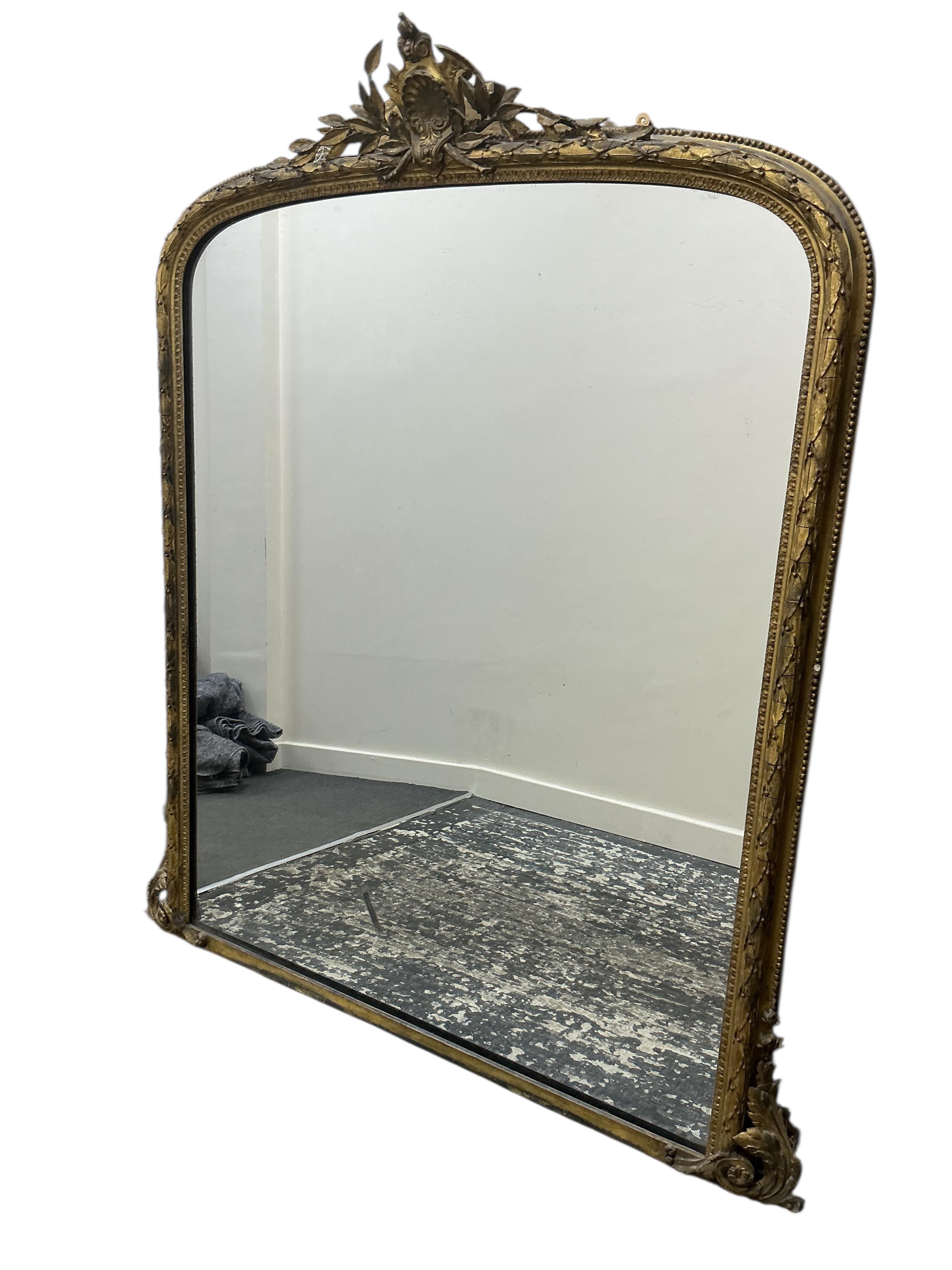 A Victorian giltwood and composition overmantel mirror, width 135cm, height 154cm